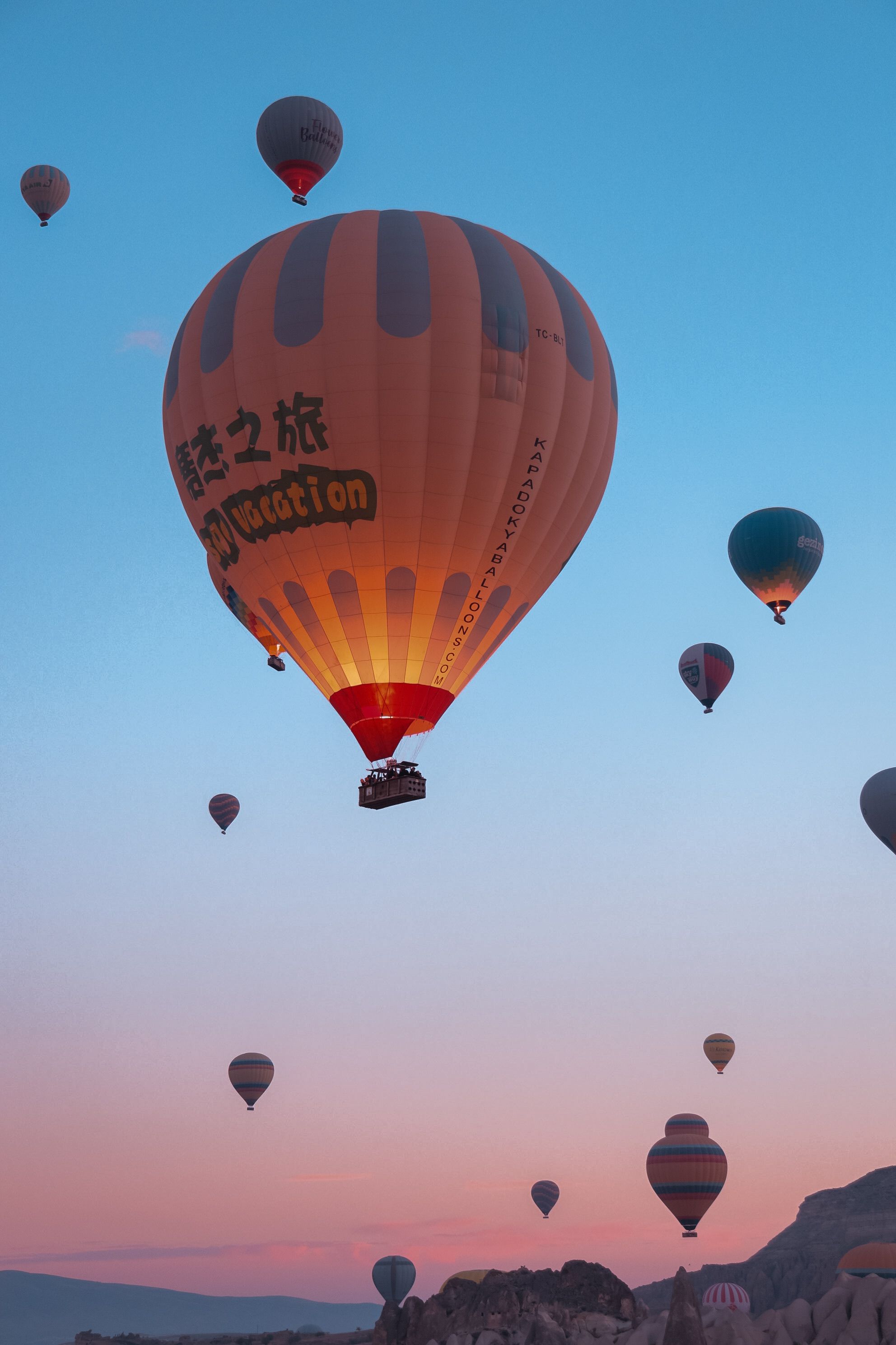 Hot air balloons floating at sunrise